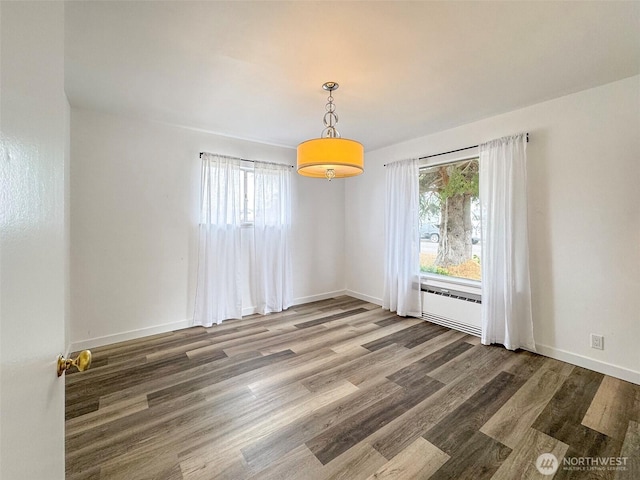 101 E Whidby Ave, Port Angeles, WA 98362 - empty room with wood finished floors and baseboards