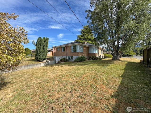 101 E Whidby Ave, Port Angeles, WA 98362 - view of grassy yard featuring a garage