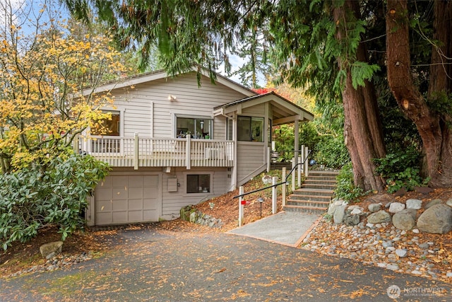 190 Bluffs Dr Unit 1, Port Townsend, WA 98368 - rustic home with stairs, a garage, and driveway
