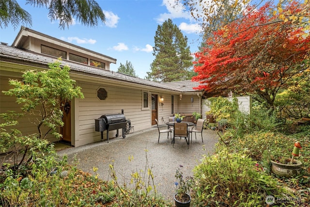 190 Bluffs Dr Unit 1, Port Townsend, WA 98368 - view of patio / terrace with a grill and outdoor dining area