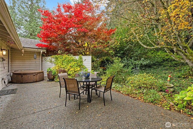 190 Bluffs Dr Unit 1, Port Townsend, WA 98368 - view of patio / terrace with a hot tub and outdoor dining space
