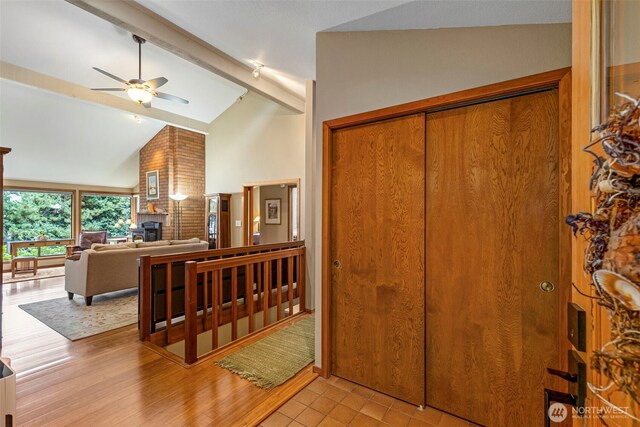 190 Bluffs Dr Unit 1, Port Townsend, WA 98368 - foyer entrance with beamed ceiling, a ceiling fan, high vaulted ceiling, and light wood-style floors