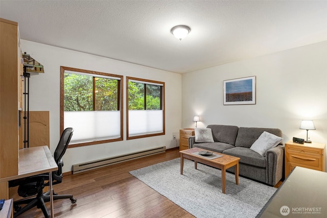 190 Bluffs Dr Unit 1, Port Townsend, WA 98368 - office space featuring a baseboard heating unit and wood finished floors