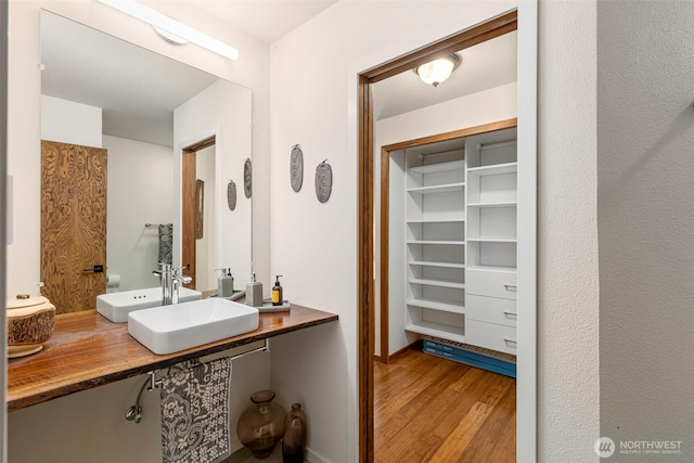 190 Bluffs Dr Unit 1, Port Townsend, WA 98368 - bathroom featuring a sink and wood finished floors