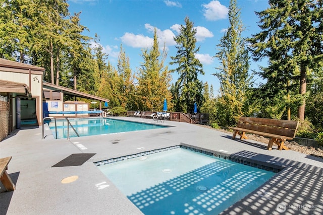 190 Bluffs Dr Unit 1, Port Townsend, WA 98368 - community pool with a patio and view of wooded area