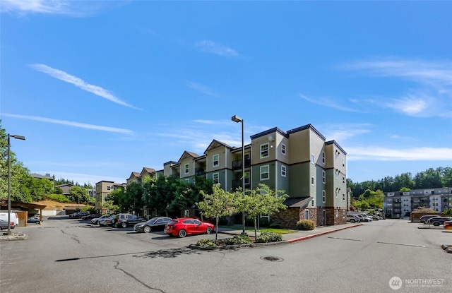 690 32nd St Unit B210, Bellingham, WA 98225 - view of property featuring uncovered parking and a residential view