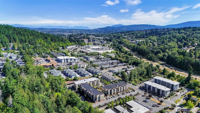 690 32nd St Unit B210, Bellingham, WA 98225 - drone / aerial view of a mountainous background and a forest