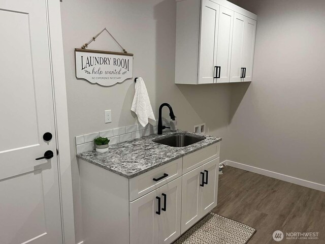 2080 Bowfin Way, Lynden, WA 98264 - washroom featuring cabinet space, hookup for a washing machine, and dark wood-style floors