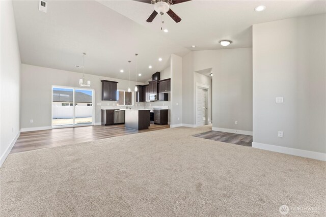 1517 7th Ave NE, Quincy, WA 98848 - unfurnished living room featuring light carpet, a ceiling fan, high vaulted ceiling, and recessed lighting