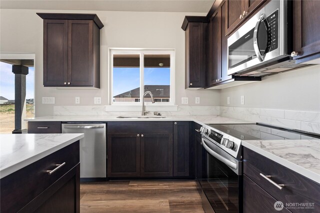 1517 7th Ave NE, Quincy, WA 98848 - kitchen with appliances with stainless steel finishes, plenty of natural light, and light stone counters