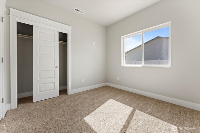 1517 7th Ave NE, Quincy, WA 98848 - unfurnished bedroom with carpet flooring and a closet