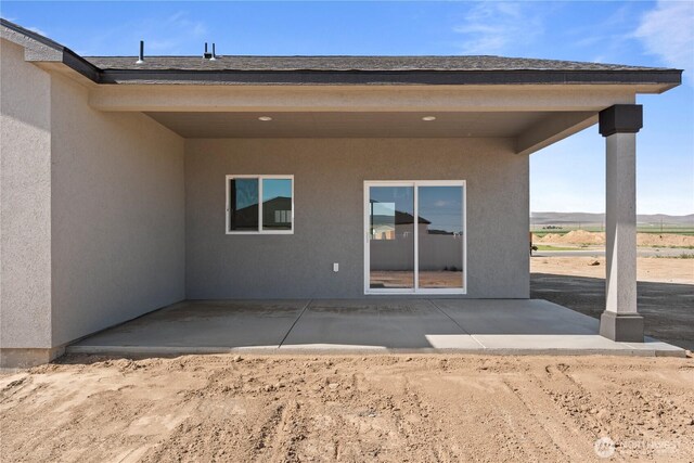1517 7th Ave NE, Quincy, WA 98848 - rear view of house with a patio area and stucco siding