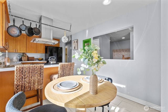 1214 E 61st St, Tacoma, WA 98404 - dining space with light tile patterned floors and baseboards