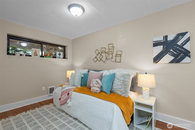 1214 E 61st St, Tacoma, WA 98404 - bedroom with wood finished floors and baseboards