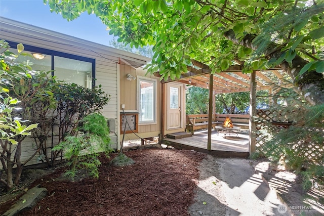 1214 E 61st St, Tacoma, WA 98404 - view of yard featuring a fire pit, a deck, and a pergola