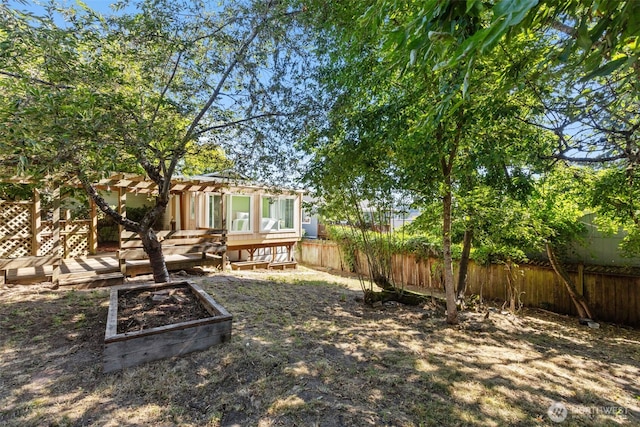 1214 E 61st St, Tacoma, WA 98404 - fenced backyard with a wooden deck and a pergola