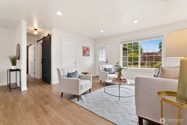 2016 3rd Ct SE, Auburn, WA 98002 - living room featuring a barn door, light wood-style flooring, and recessed lighting