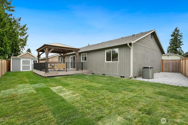 2016 3rd Ct SE, Auburn, WA 98002 - back of property with a gazebo, a wooden deck, a fenced backyard, and a storage shed