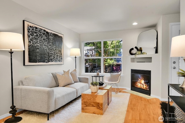 1542 15th Ave S Unit A, Seattle, WA 98144 - living area with a fireplace with flush hearth, wood finished floors, and recessed lighting