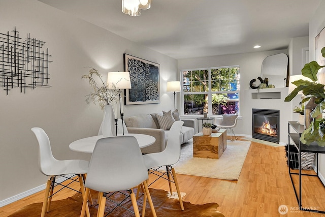 1542 15th Ave S Unit A, Seattle, WA 98144 - living room featuring a glass covered fireplace, wood finished floors, and recessed lighting