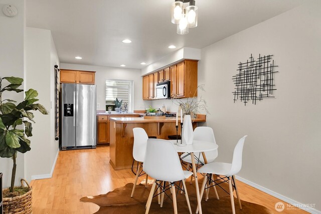1542 15th Ave S Unit A, Seattle, WA 98144 - dining room featuring light wood-type flooring and recessed lighting