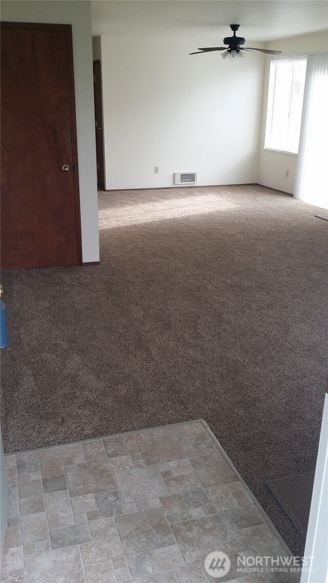 906 S 22nd Ct, Mount Vernon, WA 98274 - unfurnished room with ceiling fan and light colored carpet