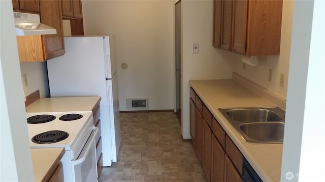 906 S 22nd Ct, Mount Vernon, WA 98274 - kitchen featuring ventilation hood, white range with electric stovetop, brown cabinets, and light countertops