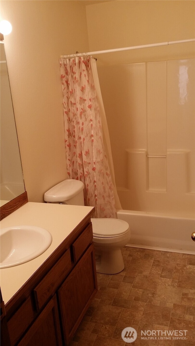 906 S 22nd Ct, Mount Vernon, WA 98274 - bathroom with vanity, shower / tub combo, and stone finish floors