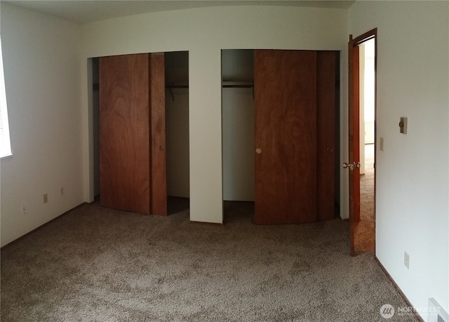 906 S 22nd Ct, Mount Vernon, WA 98274 - unfurnished bedroom with multiple closets and carpet