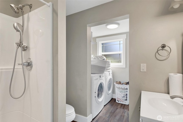 8984 Delta Line Rd, Custer, WA 98240 - bathroom with washing machine and clothes dryer, a shower, wood finished floors, and vanity