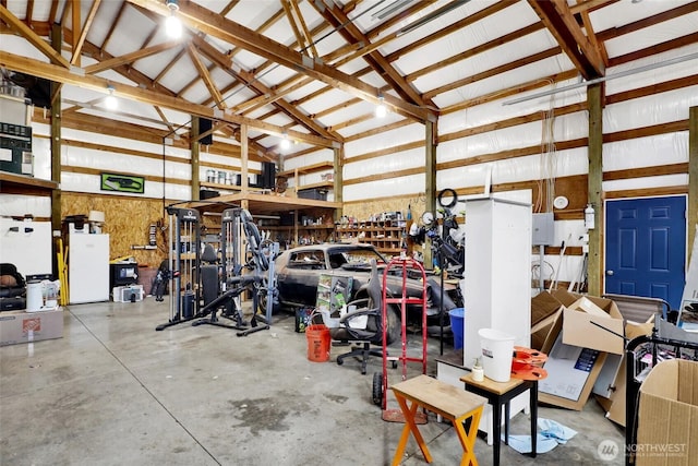 8984 Delta Line Rd, Custer, WA 98240 - garage featuring electric panel and freestanding refrigerator