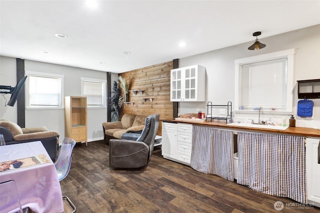 8984 Delta Line Rd, Custer, WA 98240 - kitchen featuring dark wood-type flooring, white cabinetry, open floor plan, recessed lighting, and wood walls