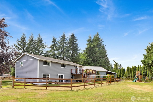 8984 Delta Line Rd, Custer, WA 98240 - rear view of house featuring a playground and board and batten siding
