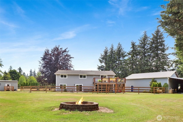 8984 Delta Line Rd, Custer, WA 98240 - back of house with an outdoor fire pit, a deck, and an outbuilding