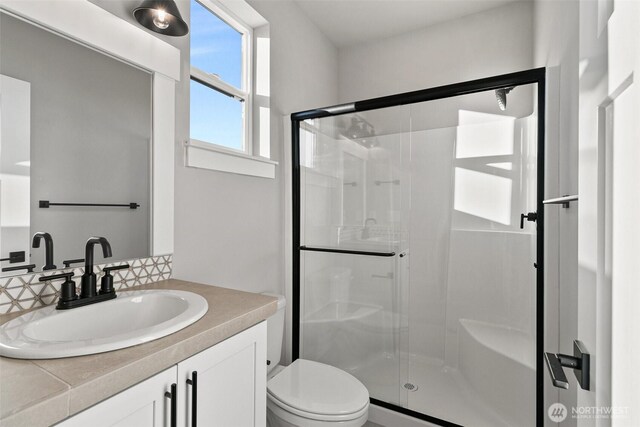 15627LOT15 SE 257th St, Covington, WA 98042 - bathroom featuring backsplash, a shower stall, and vanity