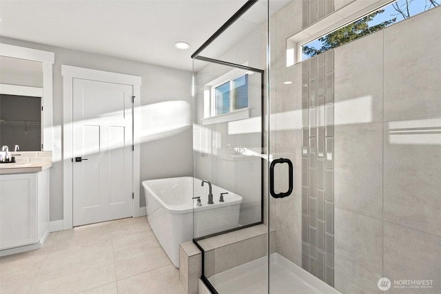 15627LOT15 SE 257th St, Covington, WA 98042 - bathroom featuring a freestanding tub, a stall shower, vanity, and tile patterned flooring