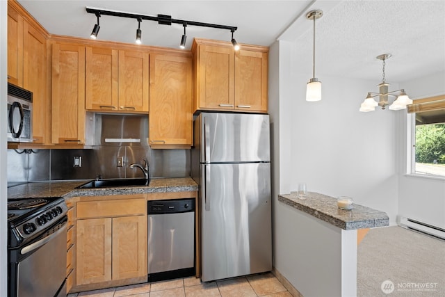 604 N 3rd St Unit 8, Tacoma, WA 98403 - kitchen with tile countertops, appliances with stainless steel finishes, decorative backsplash, a chandelier, and hanging light fixtures