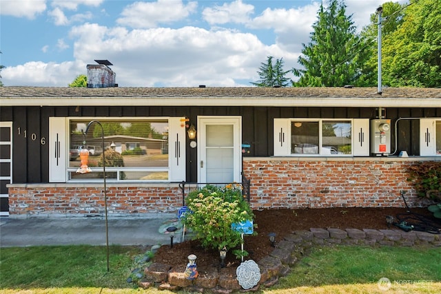 1106 SE 26th St, Auburn, WA 98002 - single story home with board and batten siding, brick siding, and a chimney