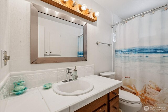 1106 SE 26th St, Auburn, WA 98002 - bathroom with vanity and a shower with shower curtain
