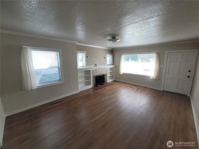 3827 A St, Tacoma, WA 98418 - unfurnished living room with wood finished floors, a textured ceiling, crown molding, and a fireplace