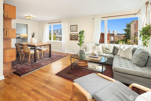 228 Aloha St Unit 403, Seattle, WA 98109 - living room with light wood-style floors and baseboards