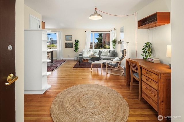 228 Aloha St Unit 403, Seattle, WA 98109 - living room featuring light wood-style floors and baseboards