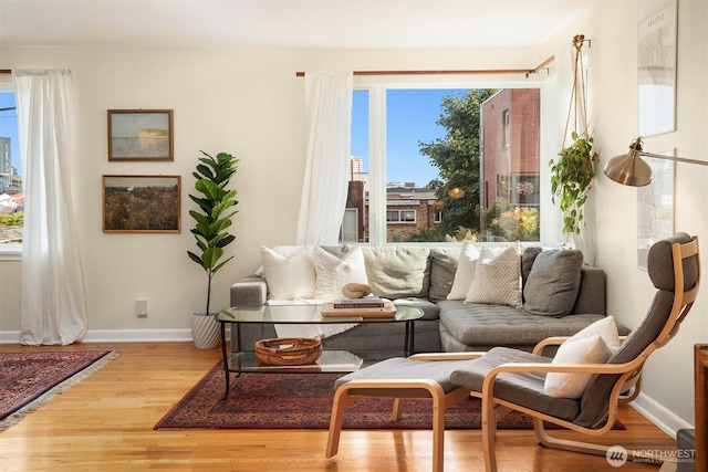 228 Aloha St Unit 403, Seattle, WA 98109 - living area featuring baseboards and light wood-style flooring