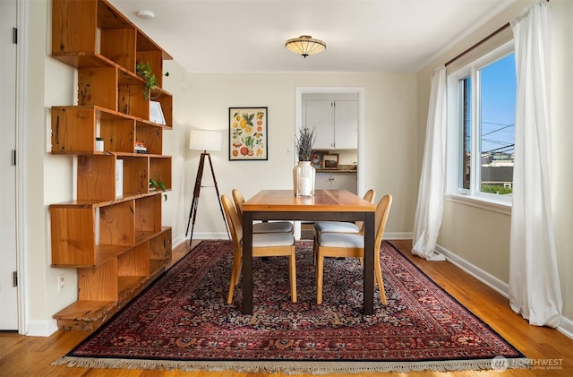 228 Aloha St Unit 403, Seattle, WA 98109 - dining area with light wood-type flooring and baseboards