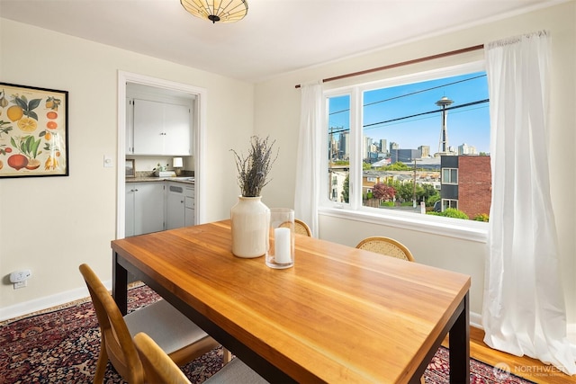 228 Aloha St Unit 403, Seattle, WA 98109 - dining space with light wood-type flooring and a city view