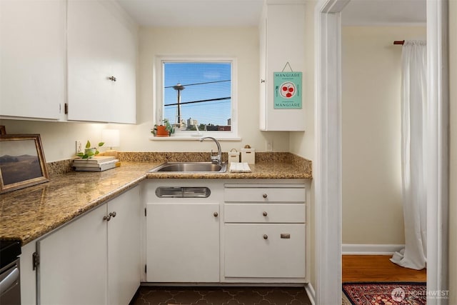 228 Aloha St Unit 403, Seattle, WA 98109 - kitchen featuring white cabinetry, light stone counters, and dark wood-style floors