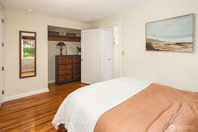 228 Aloha St Unit 403, Seattle, WA 98109 - bedroom featuring wood finished floors and baseboards
