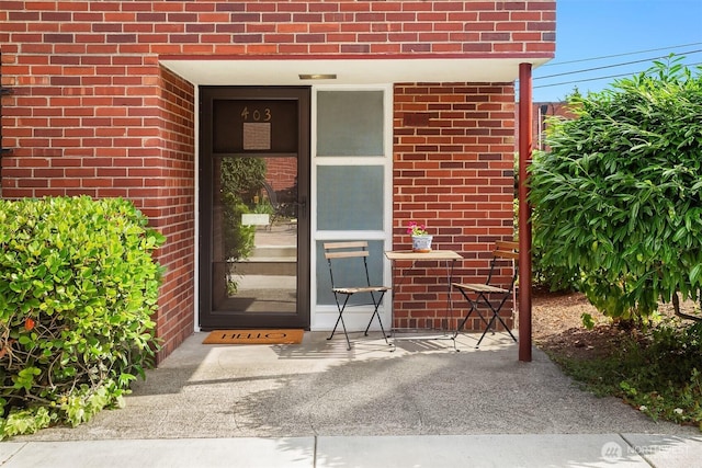 228 Aloha St Unit 403, Seattle, WA 98109 - view of exterior entry featuring brick siding