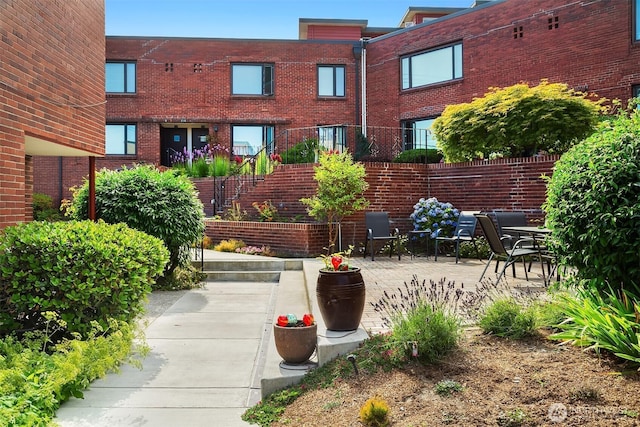 228 Aloha St Unit 403, Seattle, WA 98109 - view of property's community with a patio