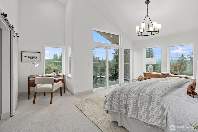 1261 NE 100th St, Seattle, WA 98125 - bedroom featuring access to outside, a chandelier, carpet floors, a barn door, and a desk